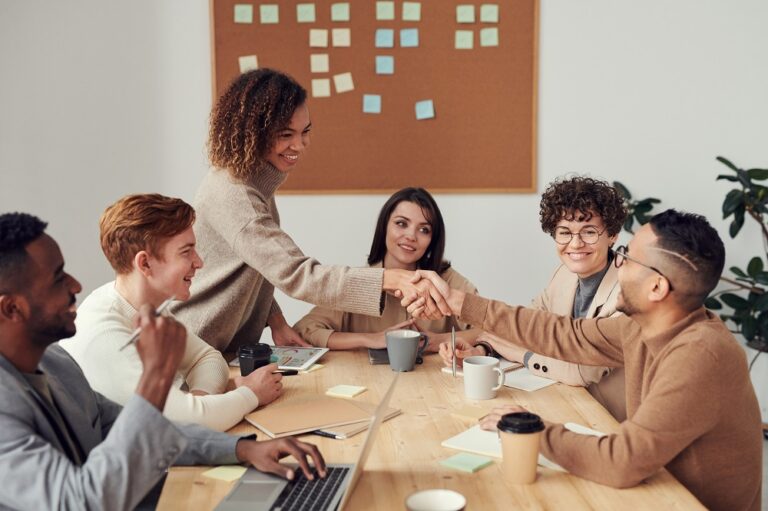 group of people sitting in meeting