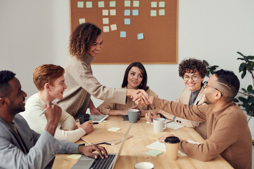 group of people sitting in meeting