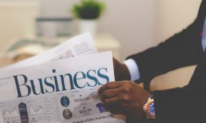 Man reading business newspaper